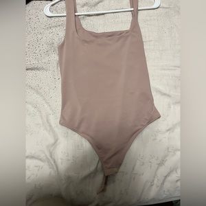 Cute pale pink bodysuit